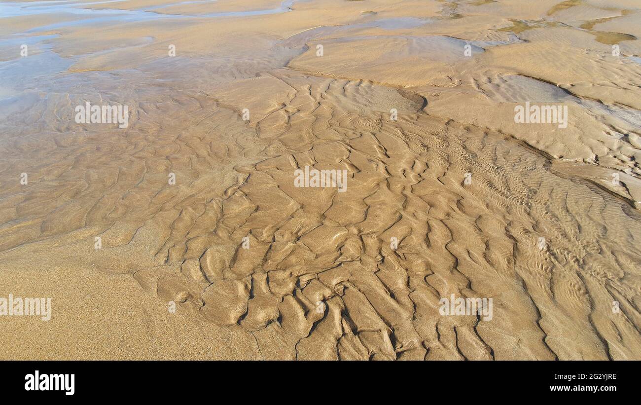 Sand and water: patterns and lines in sand created by the and water ...