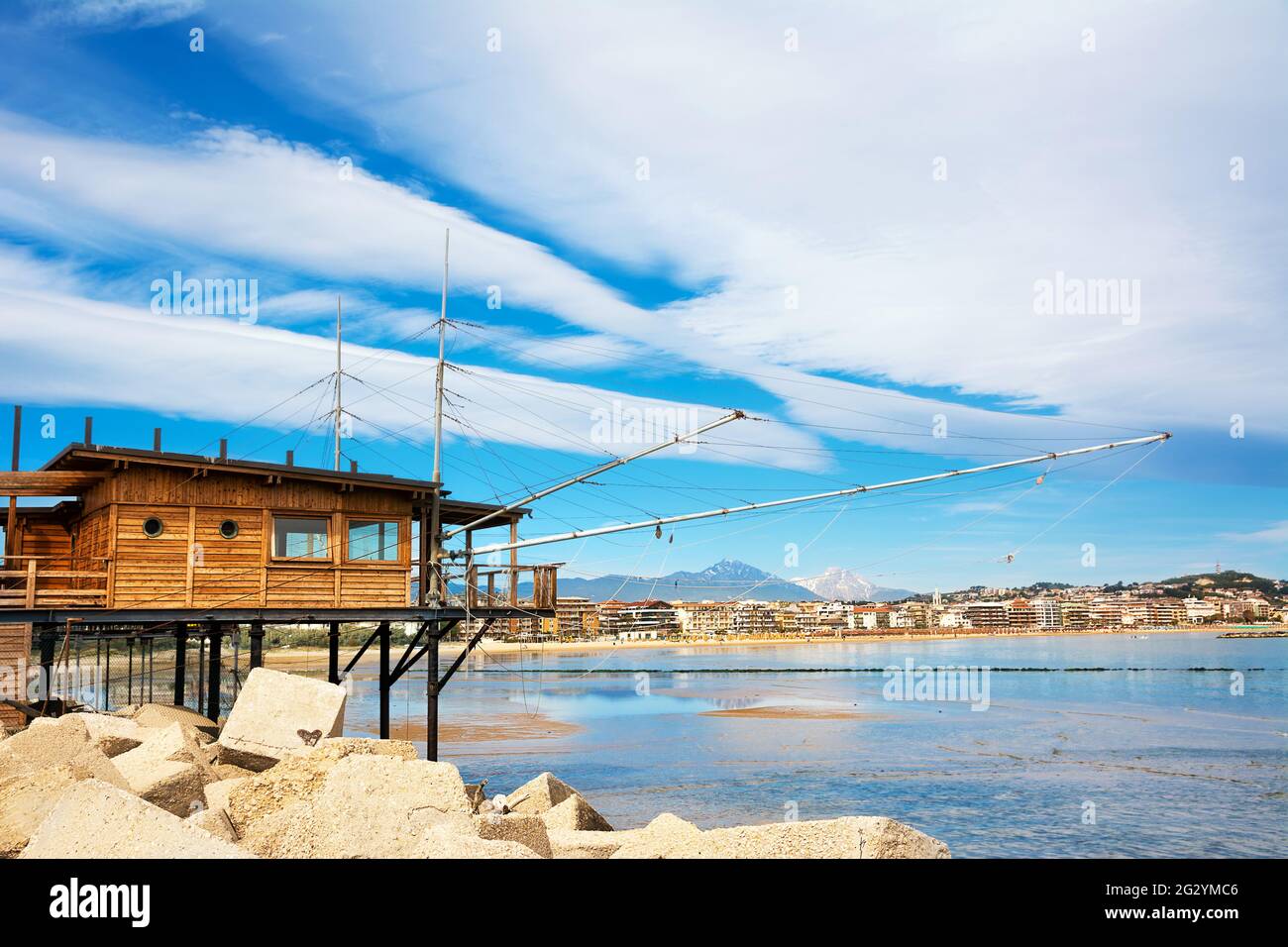 Trabucco al porto, overlooking the Pescara seafront, with the bell tower of the Divino Amore church and the Gran Sasso mountain Stock Photo
