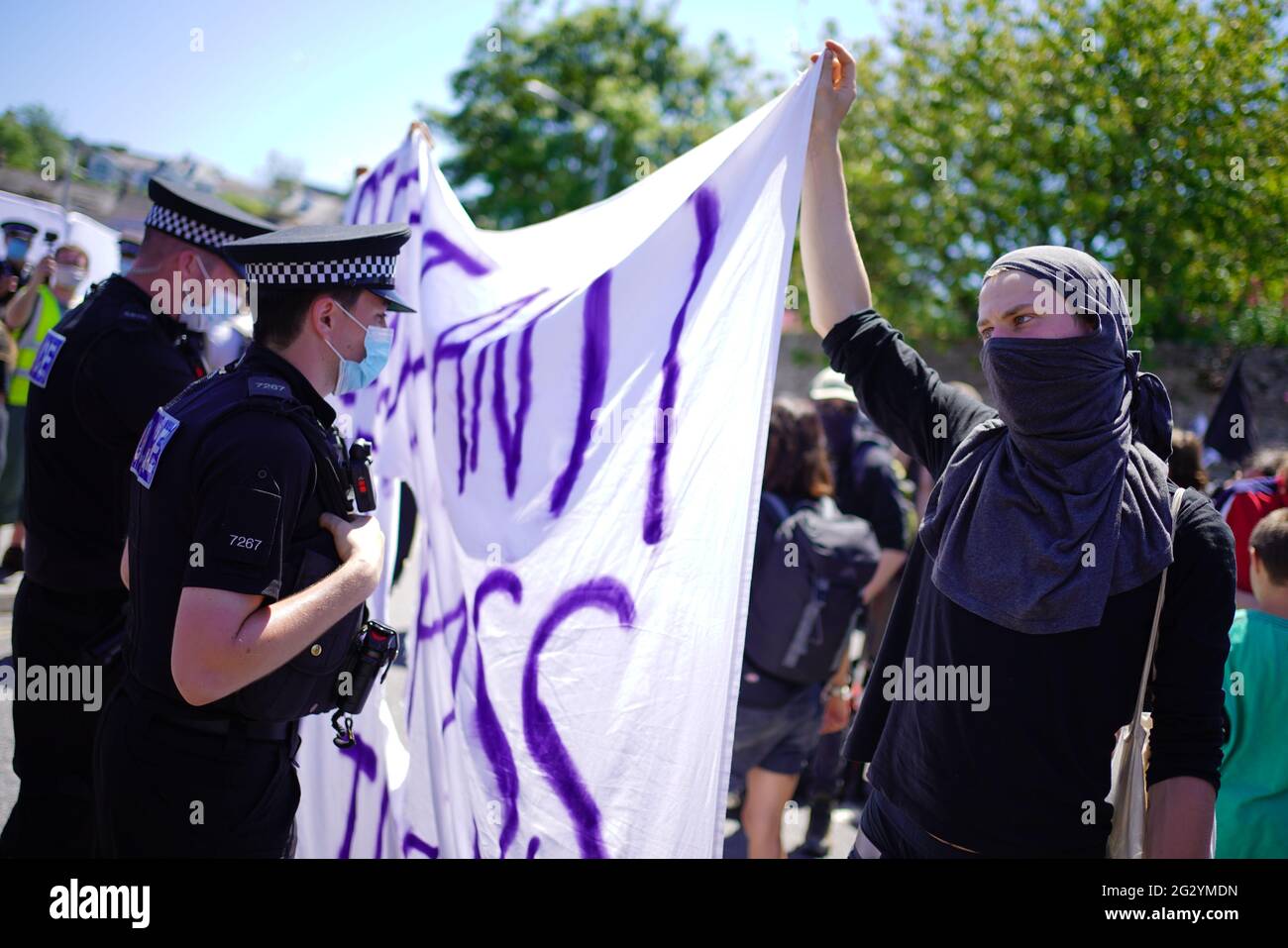 Protesters and police during a Kill the Bill protest in Falmouth, during the G7 summit in Cornwall. Picture date: Sunday June 13, 2021. Stock Photo