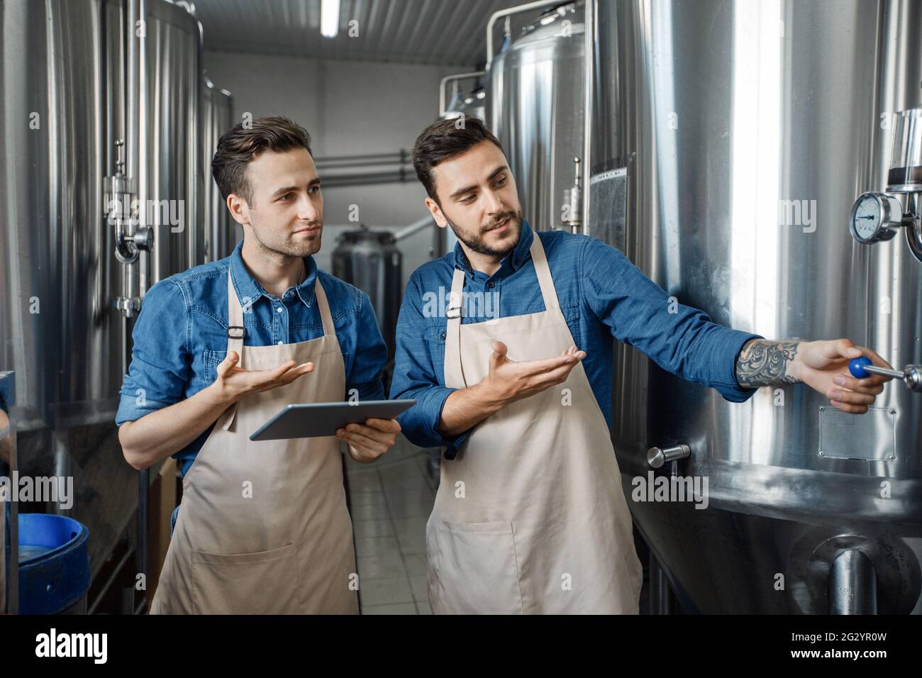 Plant management, modern technology and work at brewery Stock Photo