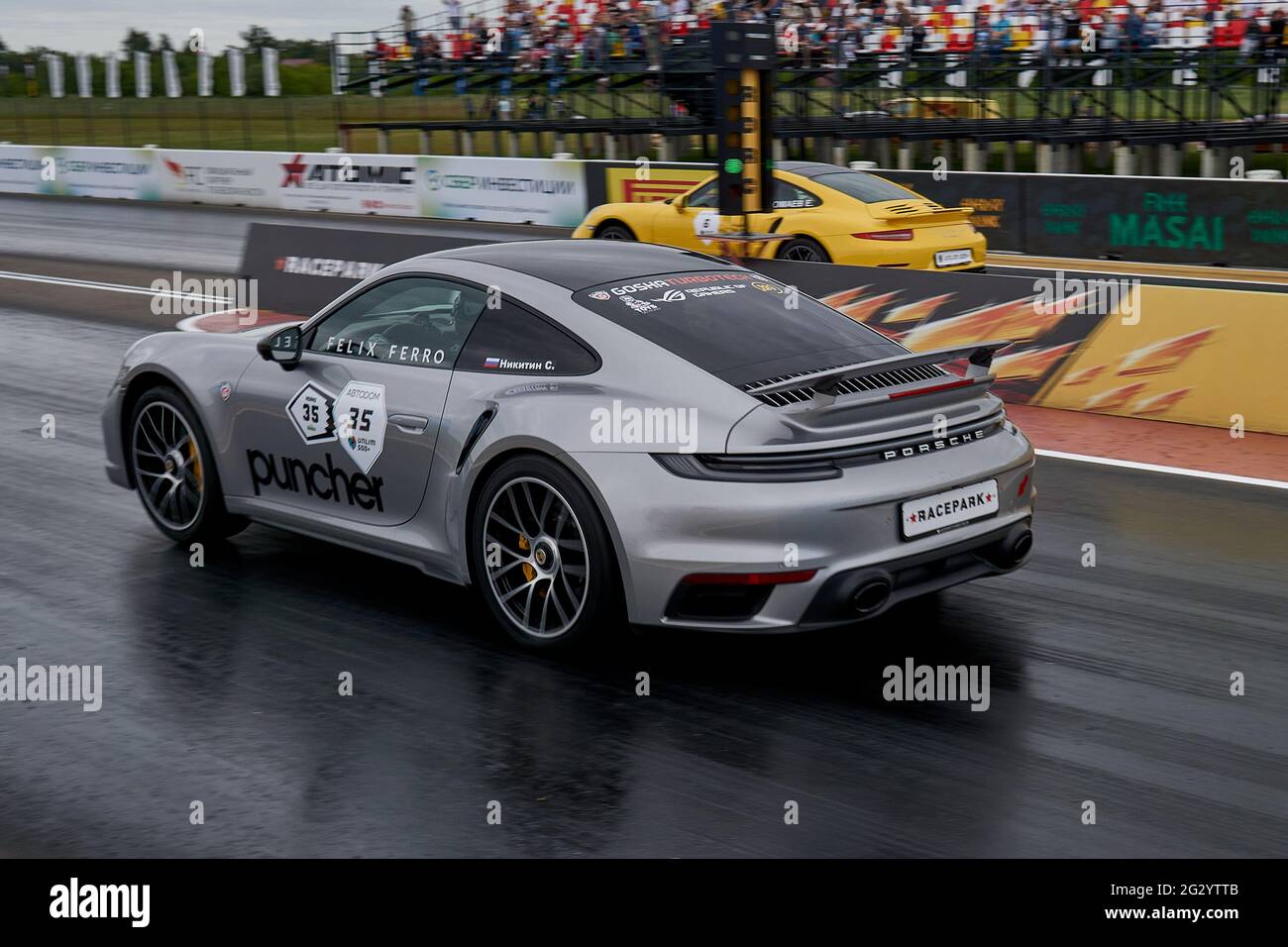 Moscow, Russia. 05th June, 2021. Gray and yellow Porsche 911s seen during the race.On June 5 and 6 at the territory of Russian Drag Racing Community (RDRC) Racepark (Bykovo airfield) in Moscow, the world's only supercar festival 'Unlim 500 held for the 23rd time. The 'Unlim 500  ' festival is a unique event in which cars with a power of more than 500 hp compete in speed. (Photo by Mihail Siergiejevicz/SOPA Images/Sipa USA) Credit: Sipa USA/Alamy Live News Stock Photo