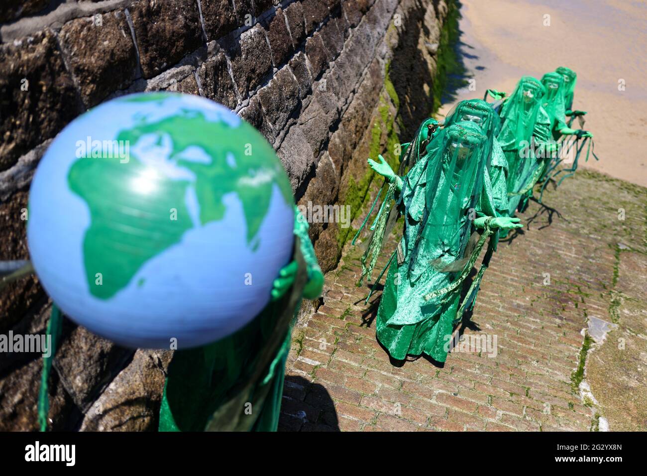 Extinction Rebellion activists protest in St Ives, during the G7 summit, in Cornwall, Britain, June 13, 2021. REUTERS/Tom Nicholson Stock Photo