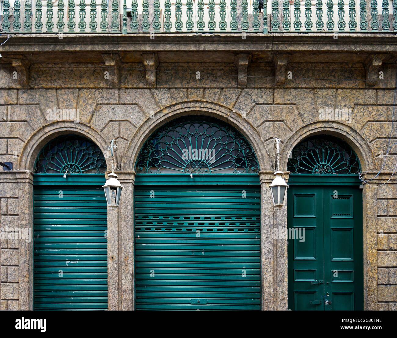 Green doors on ancient facade, downtown Rio de Janeiro Stock Photo