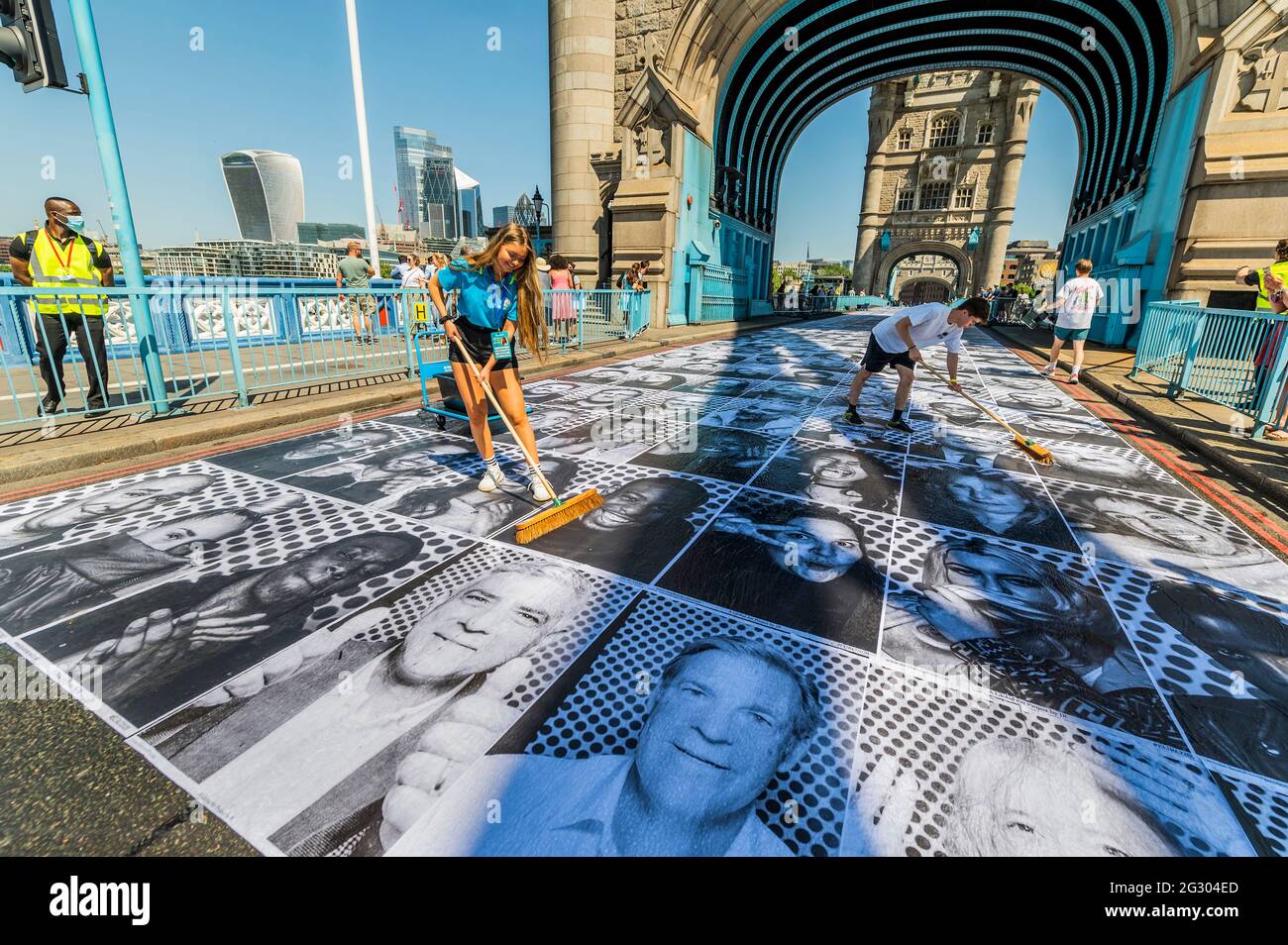 London, UK. 13 Jun 2021. Sadiq Khan (as his print on the bridge with Willaim Russell, Lord Mayor of London) visits Tower bridge as it is pasted with more than 3,000 black and white portrait photographs in celebration of the UEFA EURO 2020 Football Championships. Credit: Guy Bell/Alamy Live News Stock Photo