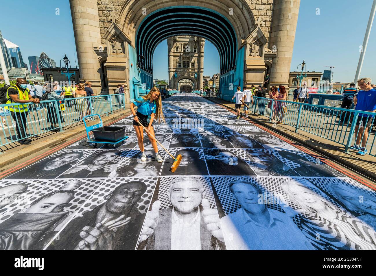 London, UK. 13 Jun 2021. Sadiq Khan (as his print on the bridge with Willaim Russell, Lord Mayor of London) visits Tower bridge as it is pasted with more than 3,000 black and white portrait photographs in celebration of the UEFA EURO 2020 Football Championships. Credit: Guy Bell/Alamy Live News Stock Photo