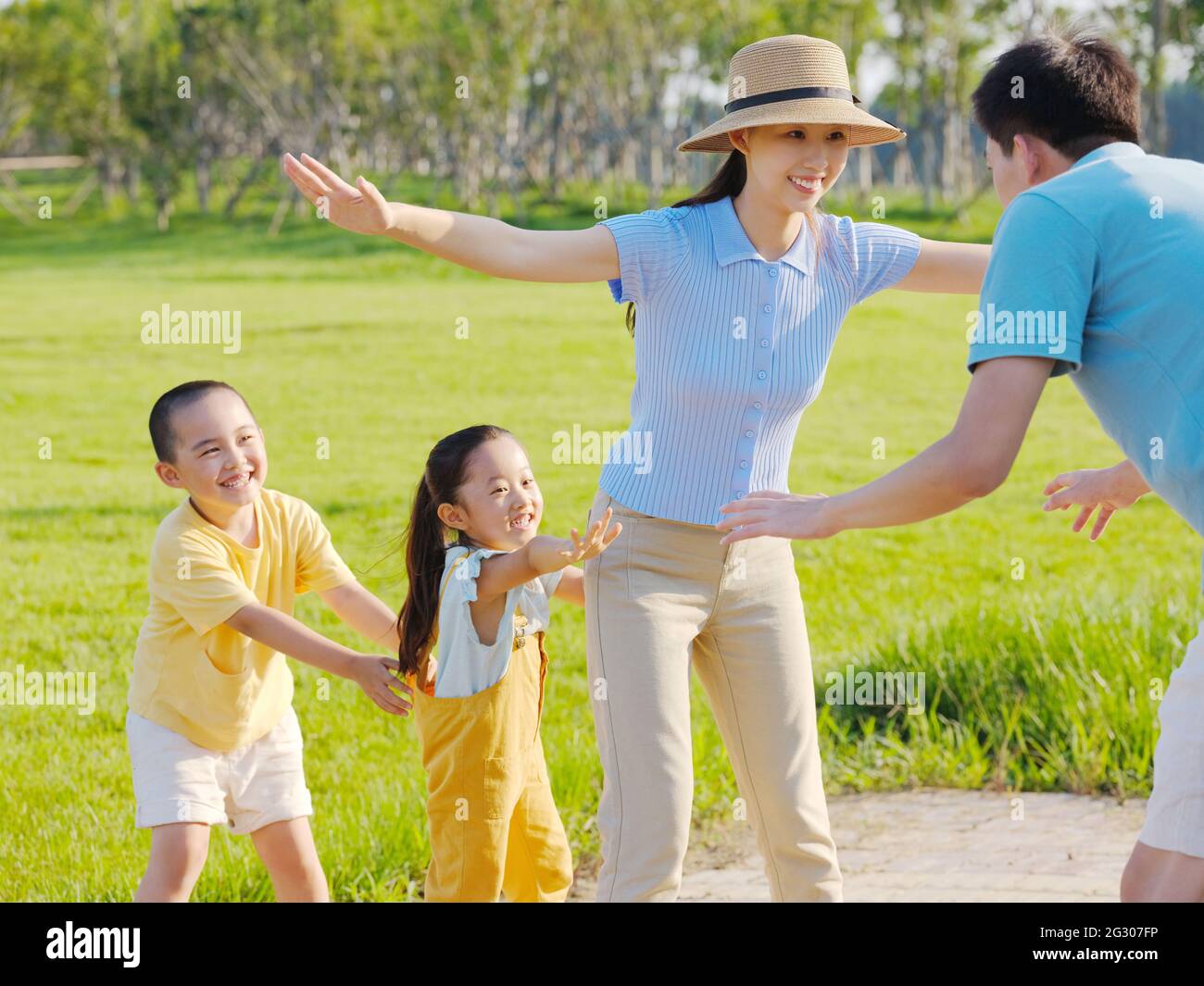 Happy family of four playing games in the park high quality photo Stock ...