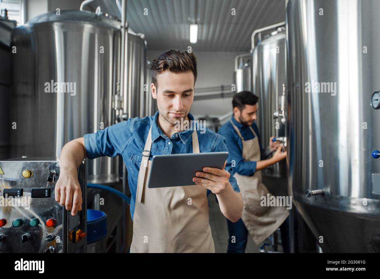 Smart factory, modern brewery management and craft beverage production Stock Photo