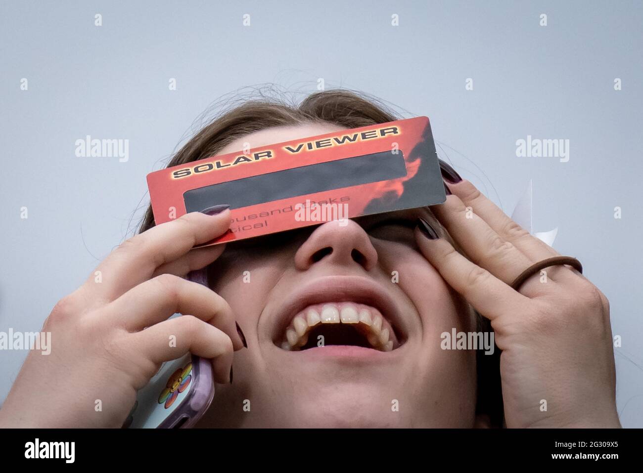 UK Weather: Partial solar eclipse seen from Greenwich Park reaches its ...