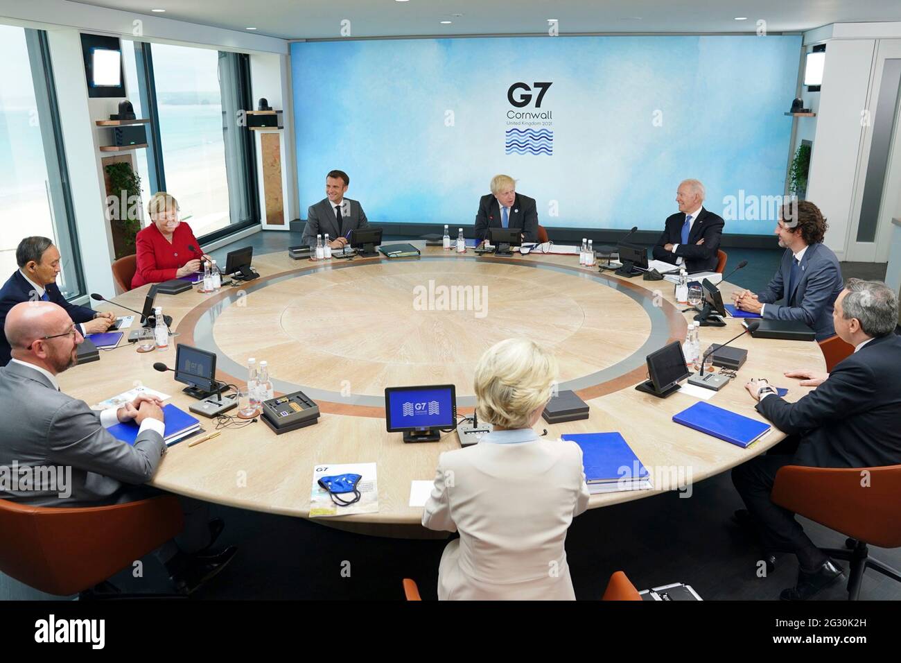 British Prime Minister Boris Johnson, center, hosts a leaders session of the G7 Summit at the Carbis Bay Hotel, June 11, 2021 in Carbis Bay, Cornwall, United Kingdom. Sitting from left to right are: European Council President Charles Michel, Japanese Prime Minister Yoshihide Suga, German Chancellor Angela Merkel, French President Emmanuel Macron, British Prime Minister Boris Johnson, U.S President Joe Biden, Canadian Prime Minister Justin Trudeau, Italian Prime Minister Mario Draghi, and European Commission President Ursula von der Leyen. Stock Photo