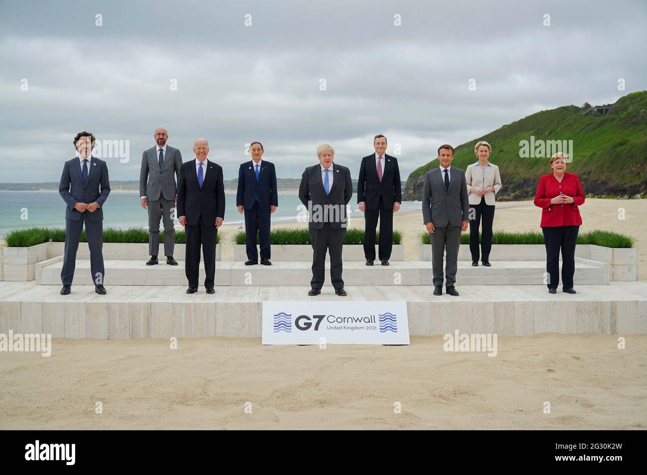 British Prime Minister Boris Johnson, center, poses with leaders of the G7 Summit during the family photo at the Carbis Bay Hotel, June 11, 2021 in Carbis Bay, Cornwall, United Kingdom. Standing from left to right are: Canadian Prime Minister Justin Trudeau, European Council President Charles Michel, U.S President Joe Biden, Japanese Prime Minister Yoshihide Suga, British Prime Minister Boris Johnson, Italian Prime Minister Mario Draghi, French President Emmanuel Macron, European Commission President Ursula von der Leyen and German Chancellor Angela Merkel. Stock Photo