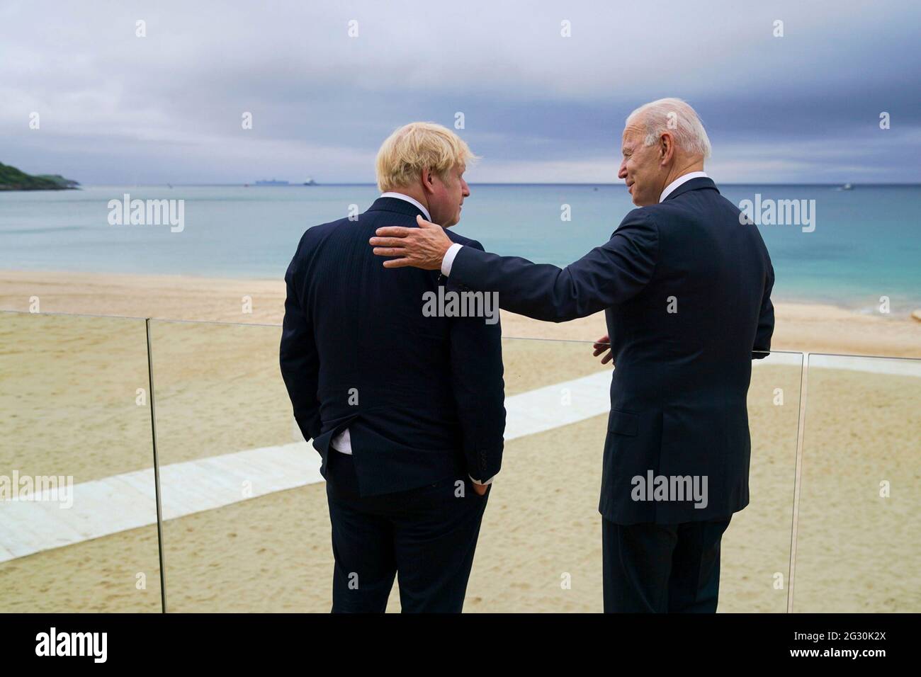 U.S President Joe Biden talks with Prime Minister Boris Johnson, left, during a walk ahead of the G7 Summit at the Carbis Bay Hotel, June 10, 2021 in Carbis Bay, Cornwall, United Kingdom. Stock Photo