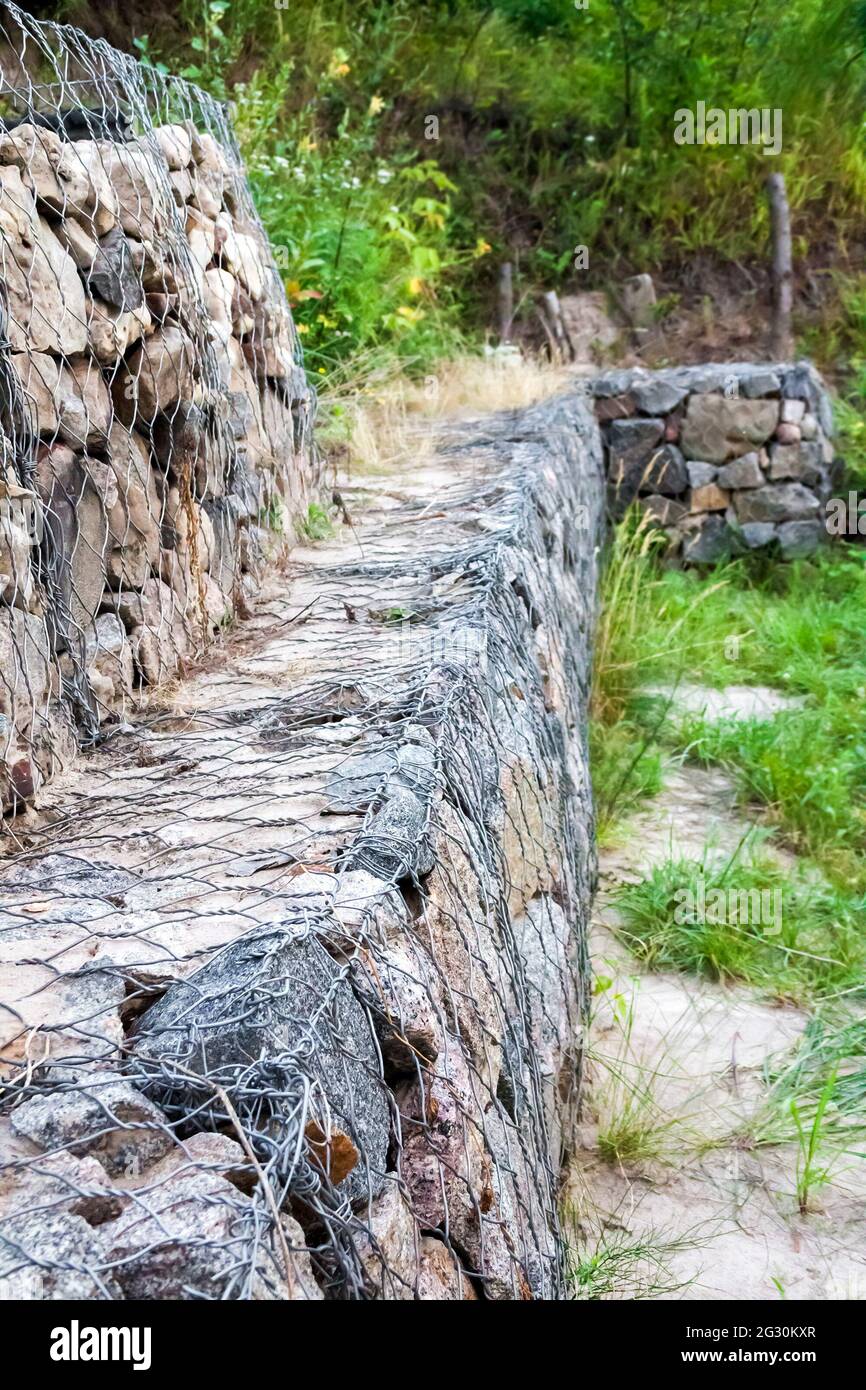 Gabion wall stones in wire mesh used for erosion control and slope