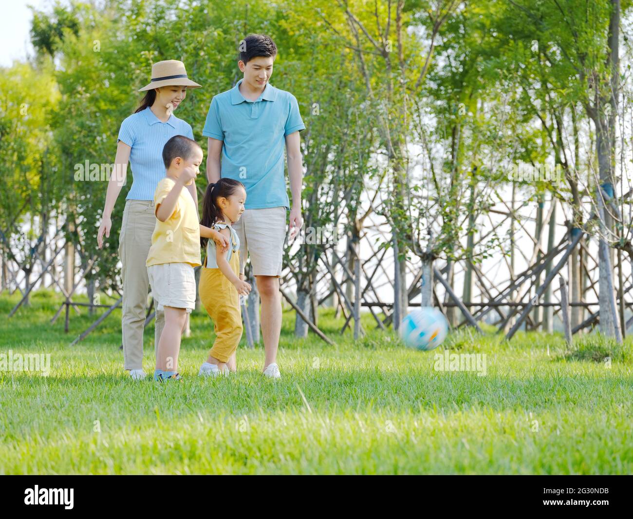 Happy family of four playing in the park high quality photo Stock Photo ...