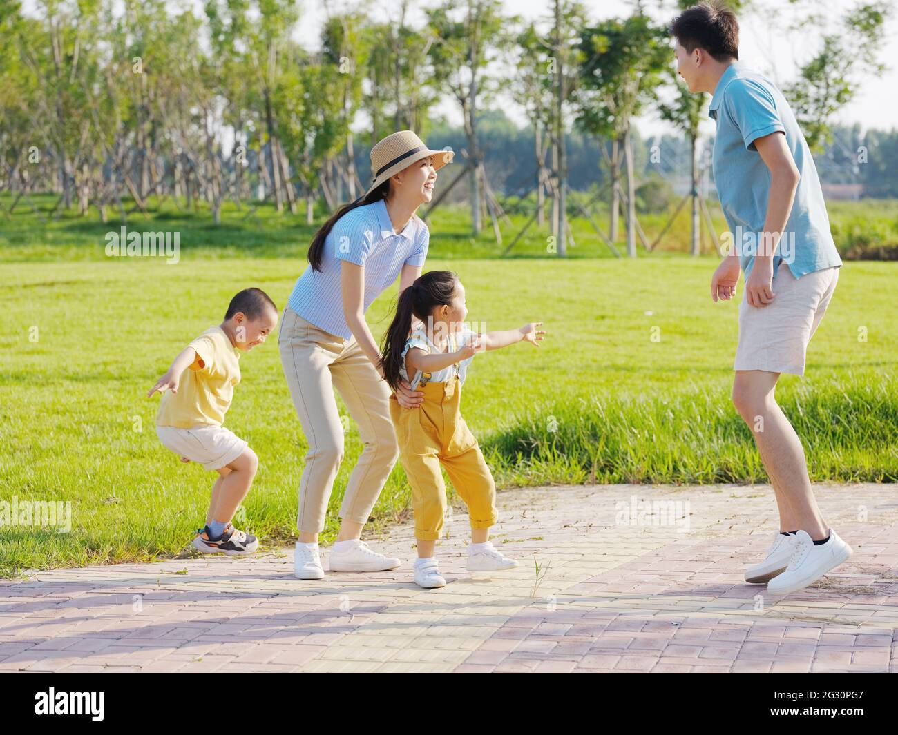 Happy family of four playing games in the park high quality photo Stock ...