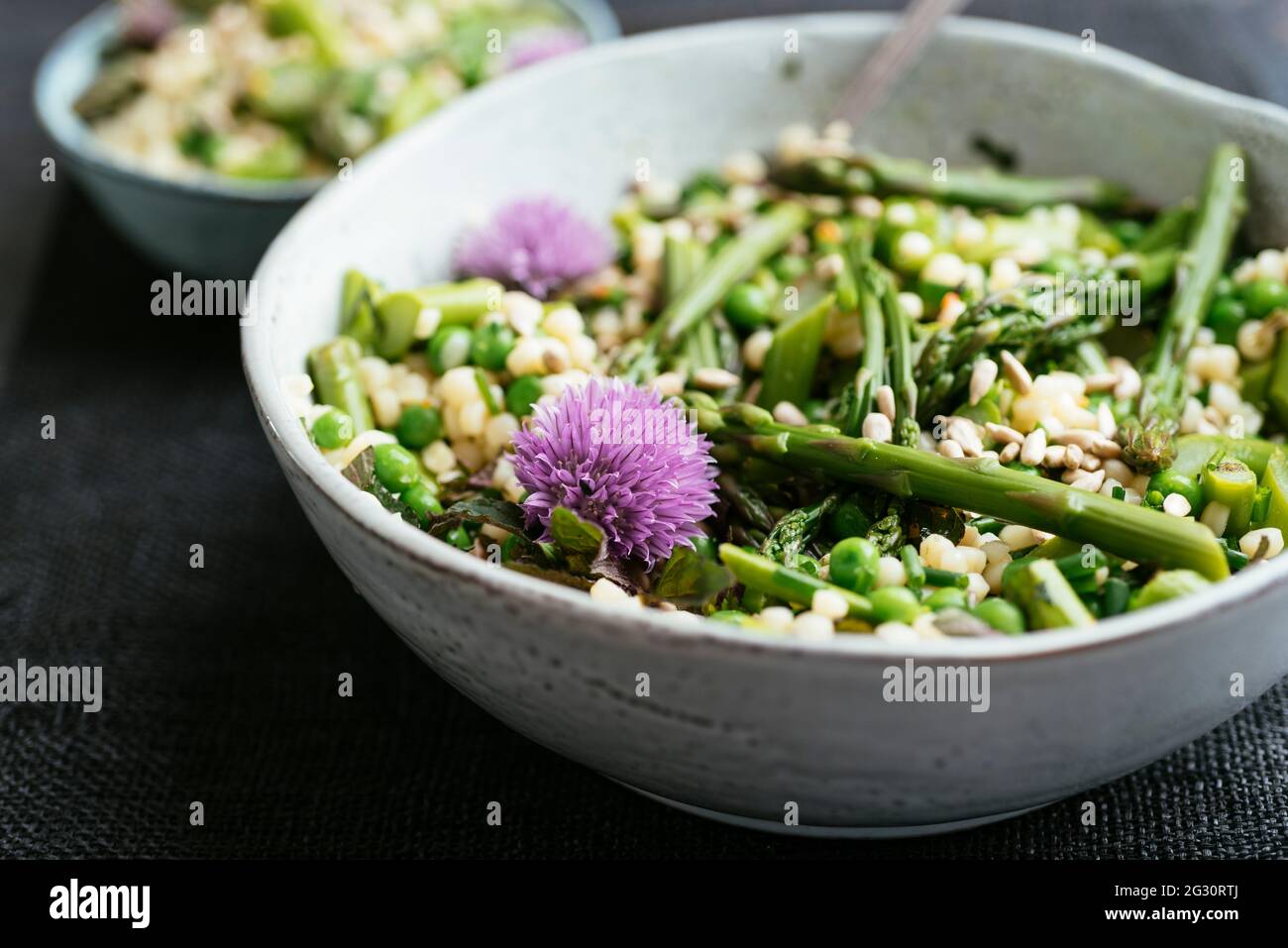 Spring salad with asparagus, Peas and Pearl Couscous Stock Photo