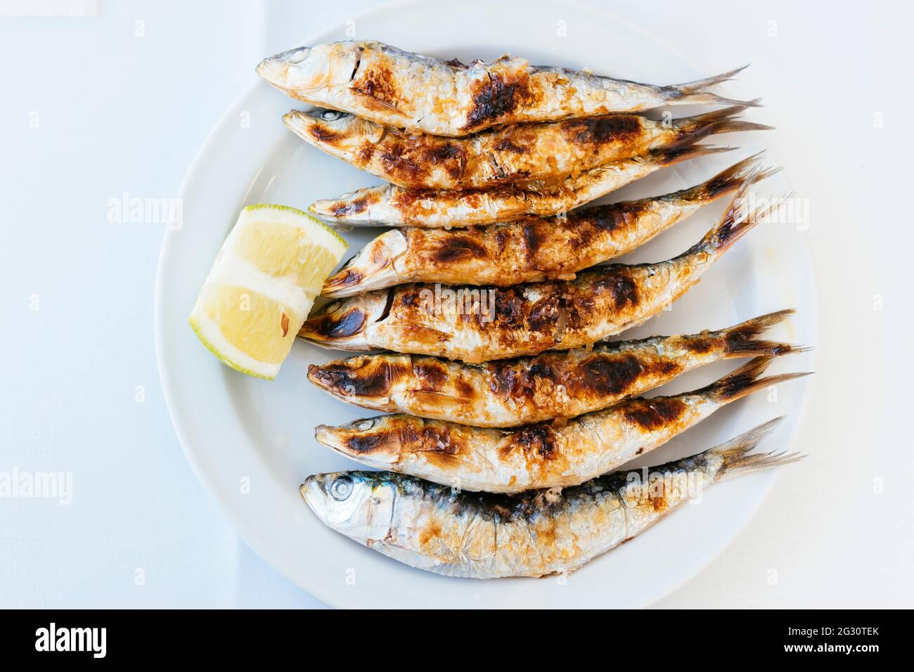 Typical Andalusian food. Grilled sardines - Sardines barbecueing. Torremolinos, Málaga, Andalucía Spain, Europe Stock Photo
