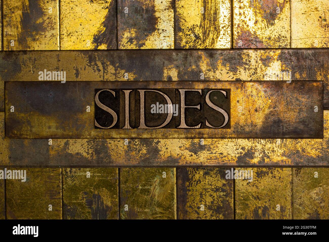 Sides text on textured copper and gold background Stock Photo - Alamy