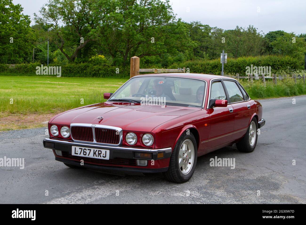1994 90s nineties red British Jaguar 4dr saloon at the 58th Annual Manchester to Blackpool Vintage & Classic Car Run The event is a ‘Touring Assembly’ Stock Photo