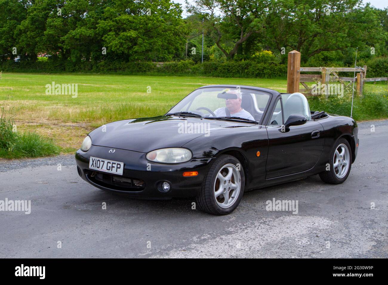 2000 black Mazda MX-5 at the 58th Annual Manchester to Blackpool Vintage & Classic Car Run The event is a ‘Touring Assembly’ Stock Photo