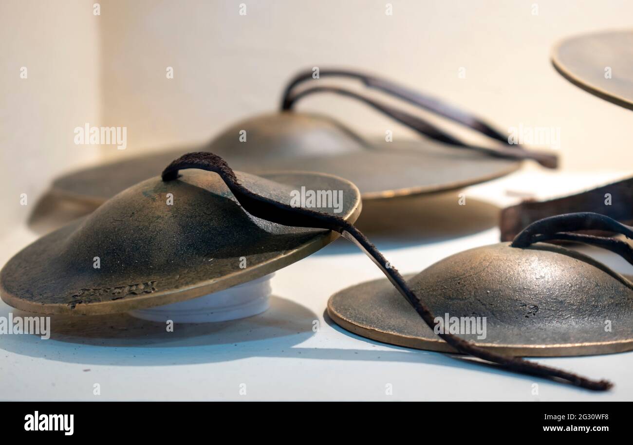 Roman zills or zils, also called finger cymbals, are small metallic cymbals used in music. Exhibition hall. Interpretation Center - Museum. The archae Stock Photo