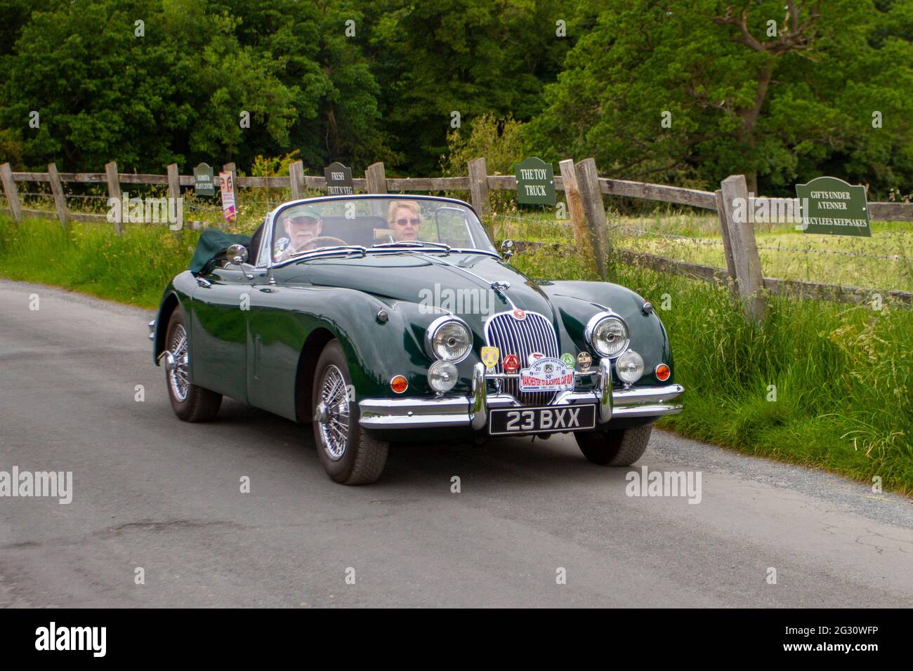 1961 60s Jaguar green 3442cc petrol cabrio, travelling to classic and  vintage car show at Heskin Hall , Lancashire, UK Stock Photo - Alamy