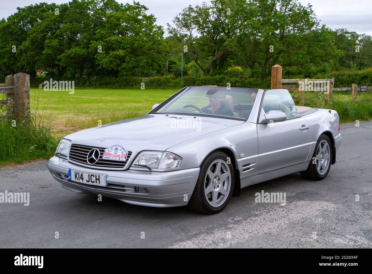 A silver Mercedes Sl320 Auto Silver Car Annual Manchester to Blackpool Vintage & Classic Car Run The event is a ‘Touring Assembly’ Stock Photo