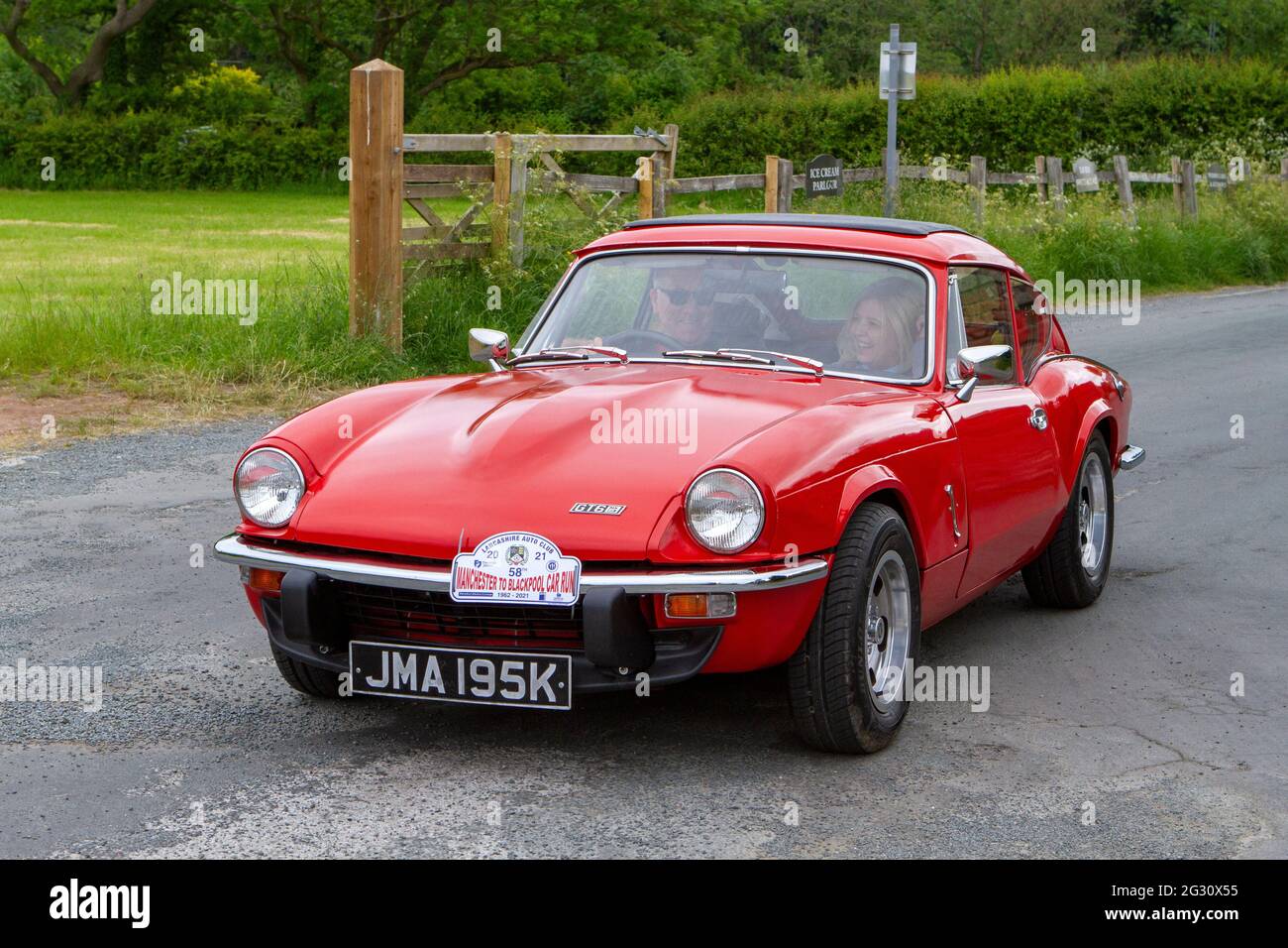 A Red Triumph Gt6 coupe Annual Manchester to Blackpool Vintage & Classic Car Run The event is a ‘Touring Assembly’ Stock Photo