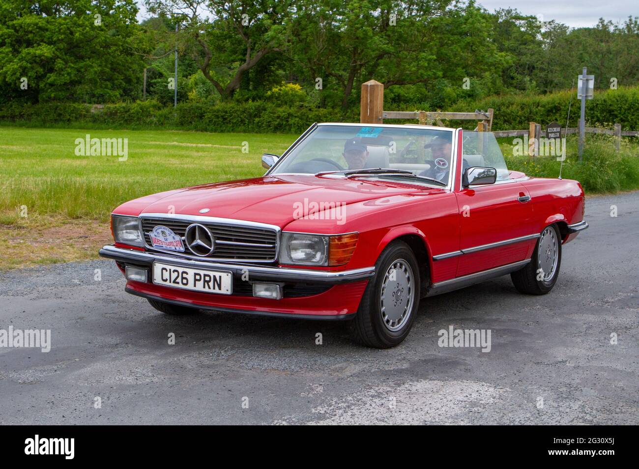 1986 80s, eighties red Mercedes Benz Cabrio, PetroL 2998 cc  at the 58th Annual Manchester to Blackpool Vintage & Classic Car Run The event is a ‘T Stock Photo