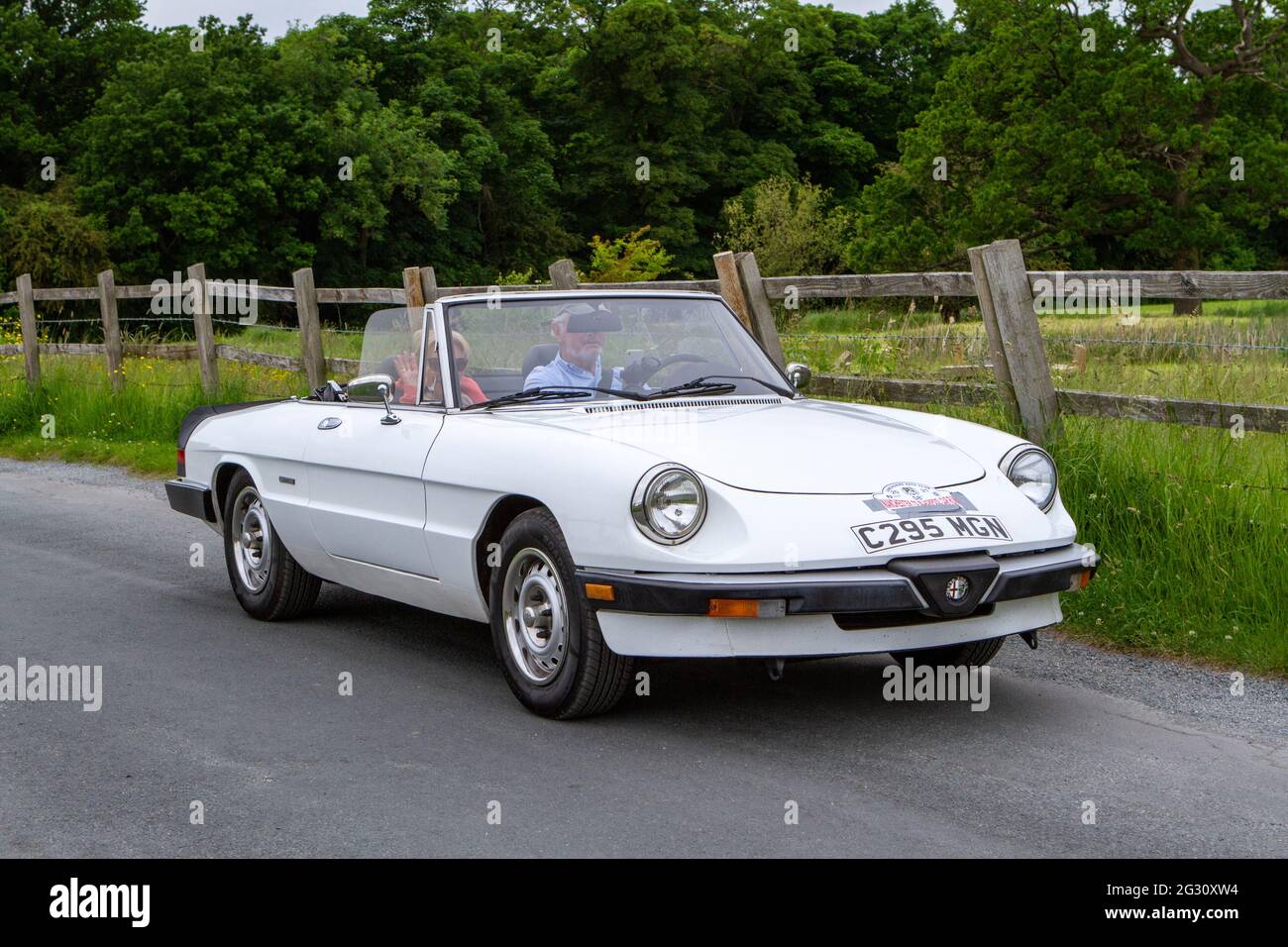 1986 80s white Alfa Romeo Spider 2000cc petrol sports at the 58th Annual Manchester to Blackpool Vintage & Classic Car Run event  a ‘Touring Assembly’ Stock Photo