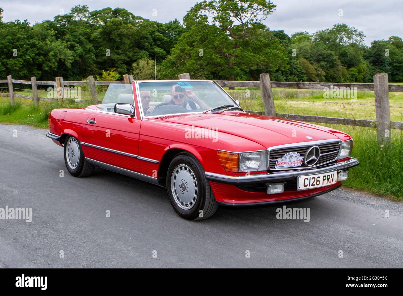 1986 80s red Mercedes Benz cabrio at the 58th Annual Manchester to Blackpool Vintage & Classic Car Run The heritage event is a ‘Touring Assembly’ Stock Photo