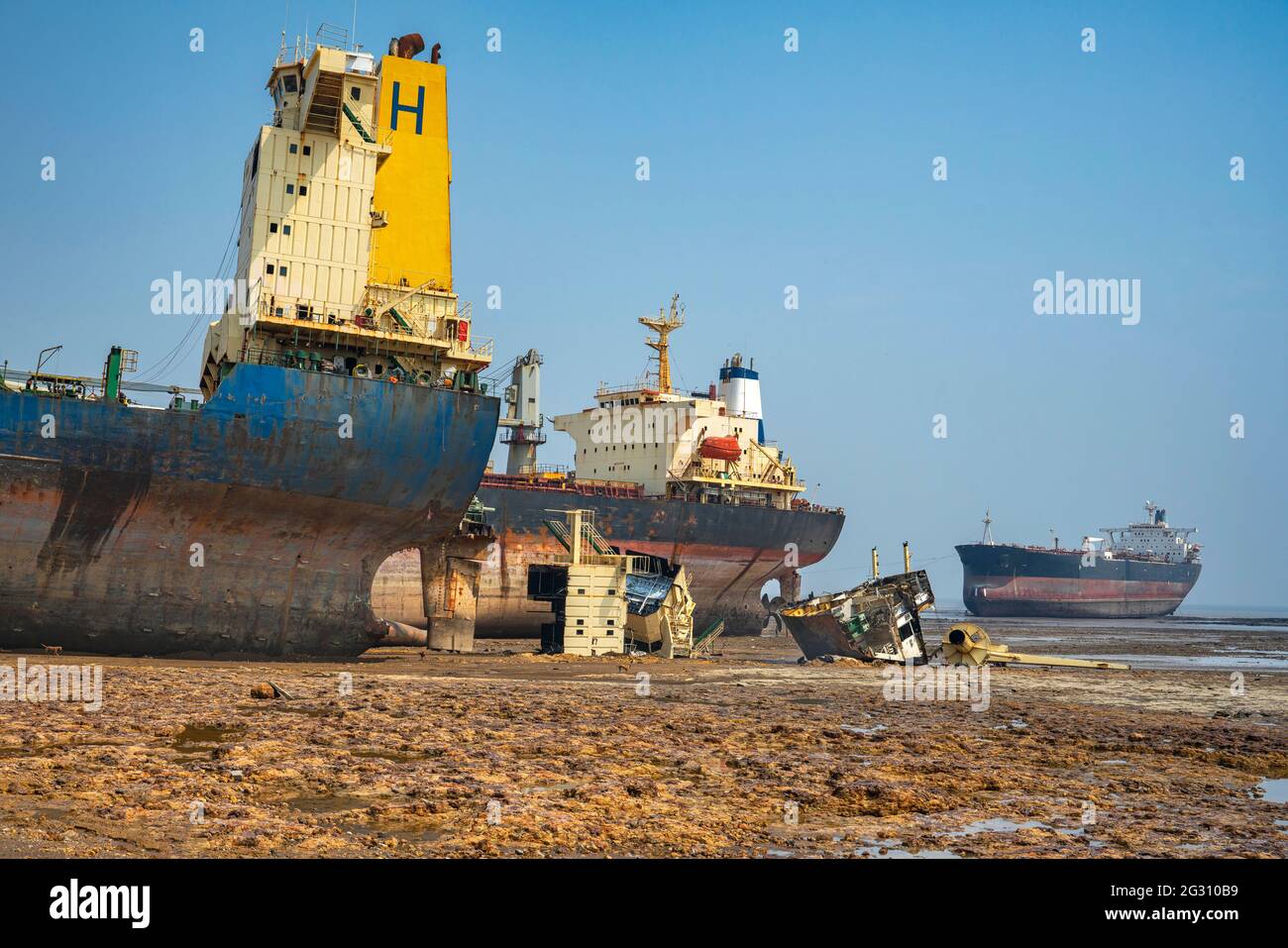 Alang ,01, February, 2016: Wide angle view of ship breaking yard with half cut ship and parts with ship in sea  background Bhavnagar, Gujarat, India Stock Photo