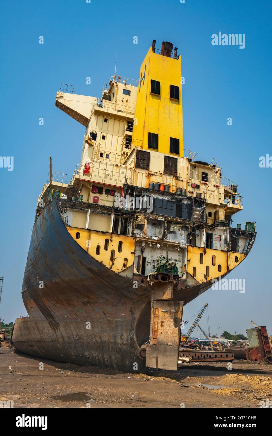 Alang ,01,February,2016: Low angle showing cut section of ship in perspective and yard activities in background at BreakingYard, Bhavnagar,Gujarat , Stock Photo