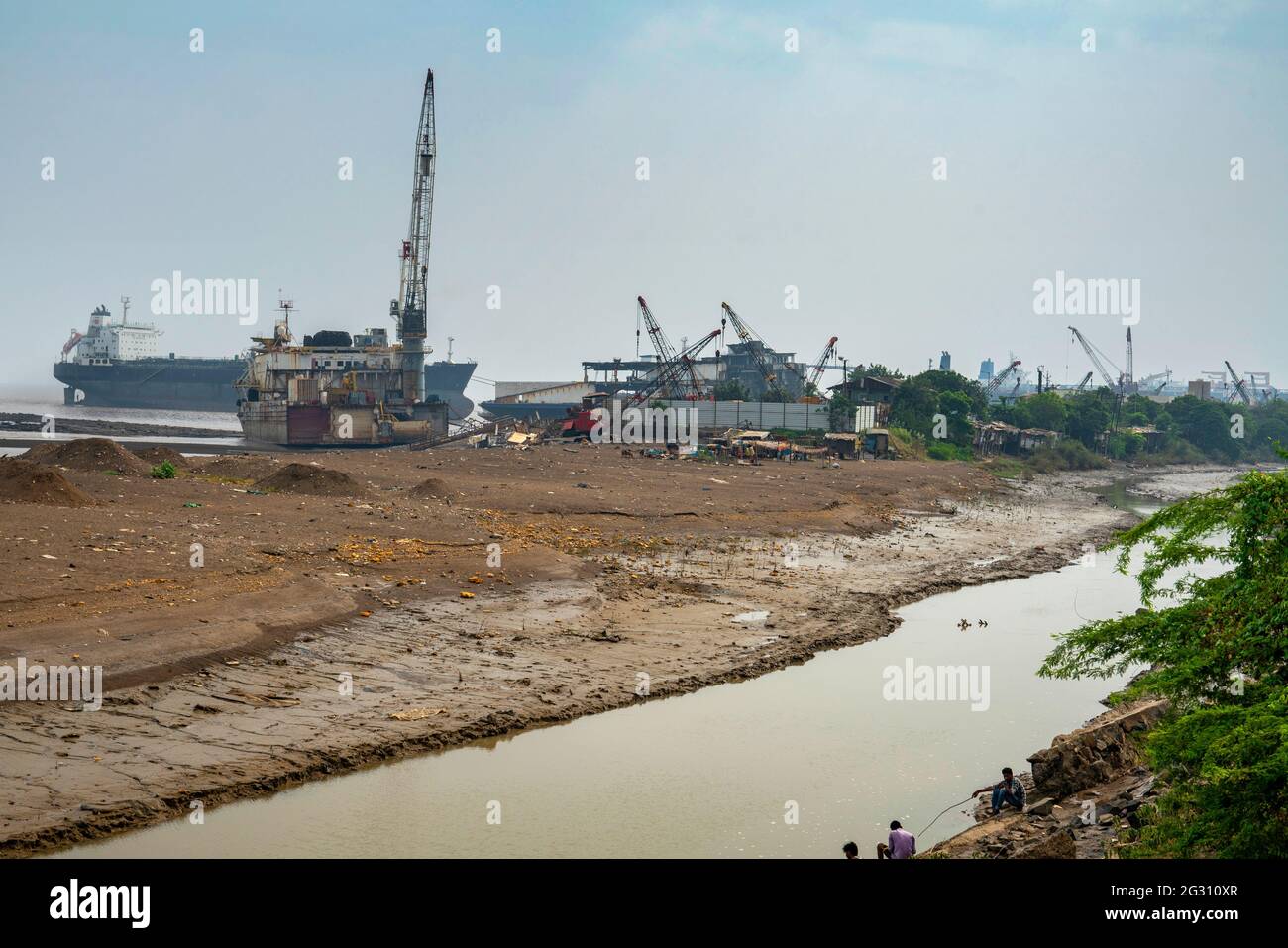 Alang ,01, February, 2016: View from backwaters  of            Ship BreakingYard with anchored vessels and infrastructure,Bhavnagar,    Gujarat,India Stock Photo
