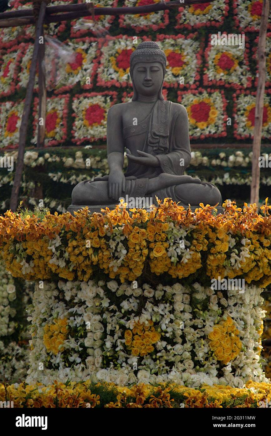 The Buddha stat on decorated flower platform in Lalbagh, Bengaluru, India, Asia Stock Photo