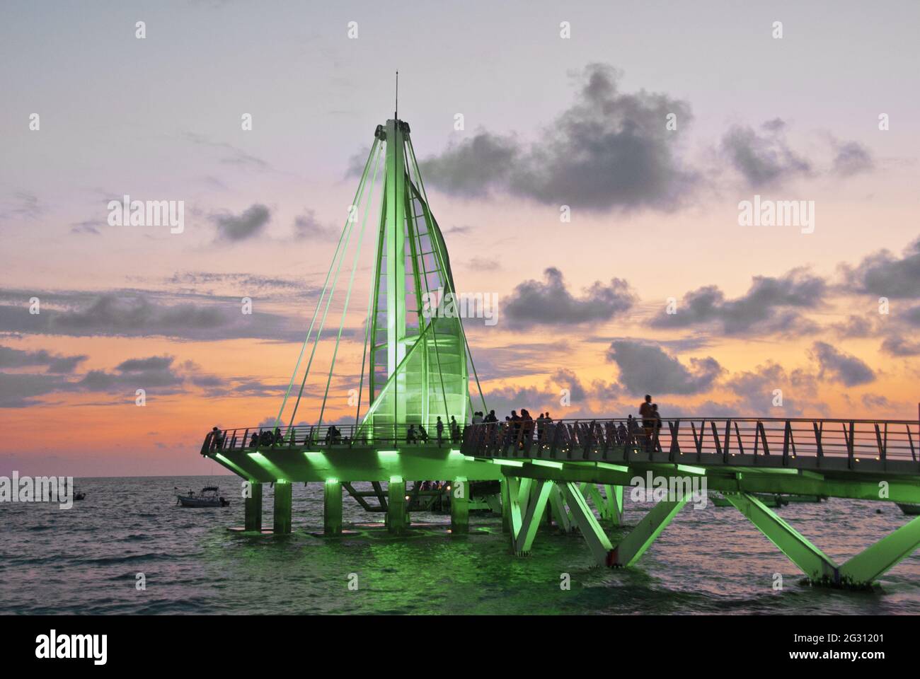 Sail sculpture and pier change colors at night - inaugurated in 2013 and designed by Mexican architect Jesus Torres Vega, the pier features a surface Stock Photo