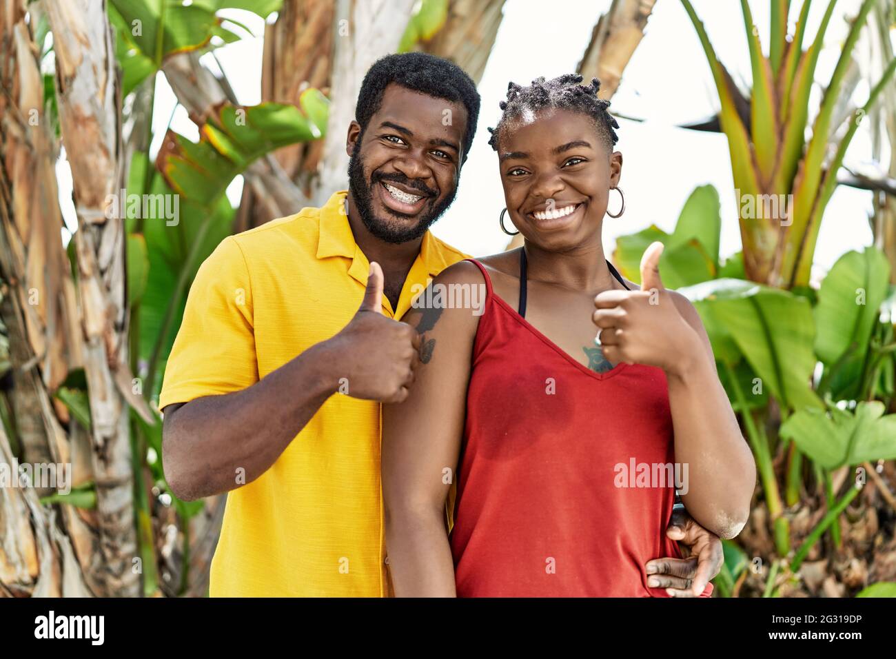 Young african american couple wearing casual clothes standing at the ...