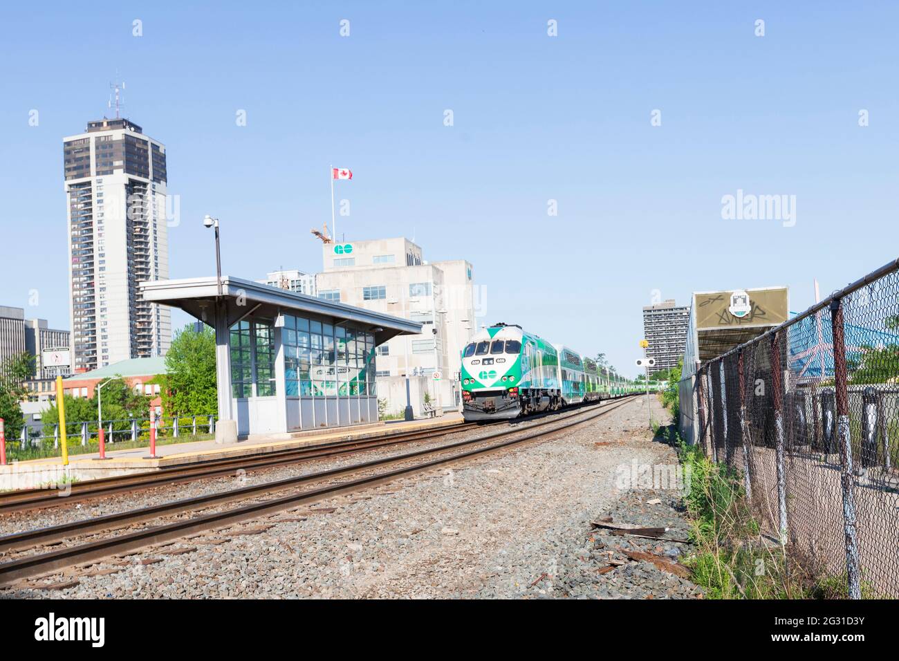 HAMILTON, Ontario, Canada - June 2021: Go Transit train is parked on the railway at the Go Transit train station in downtown Hamilton. Stock Photo