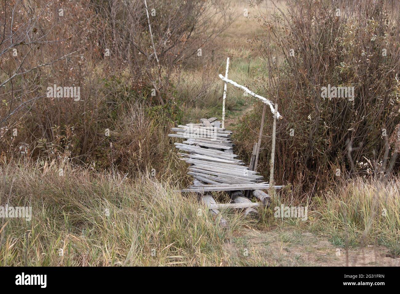 Old wooden bridge over stream in abandoned village Stock Photo - Alamy
