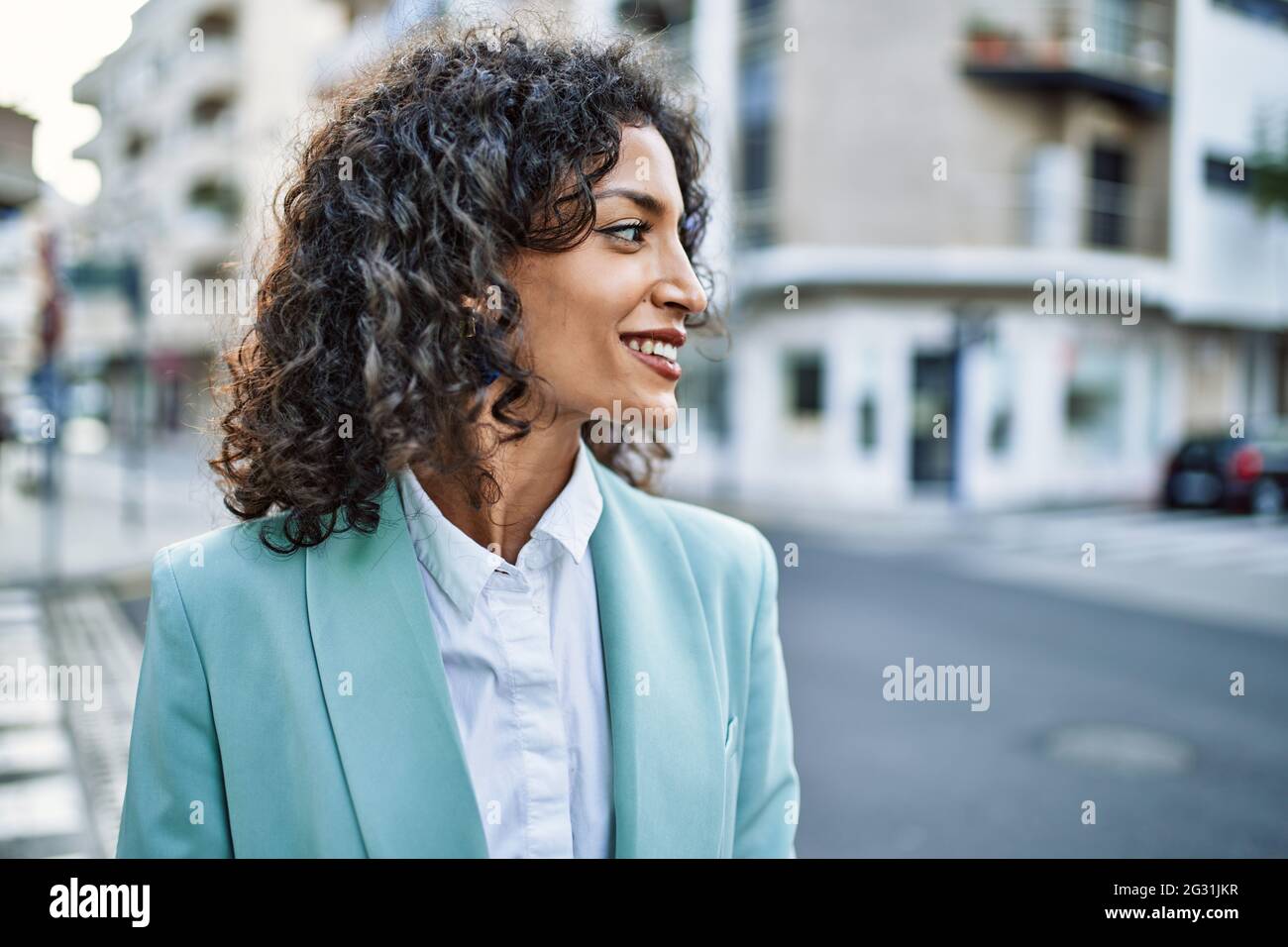 Young hispanic business woman wearing professional look smiling ...
