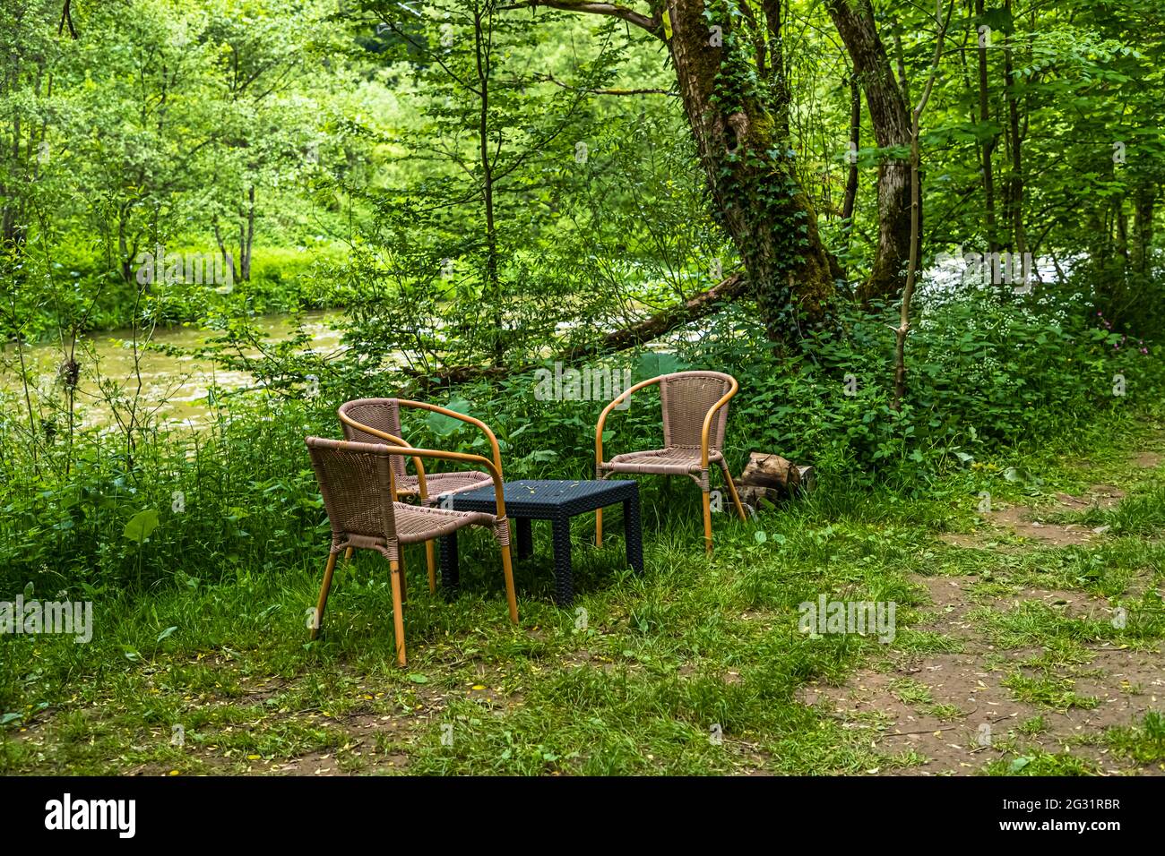 Outdoor furniture on the river Sûre, Luxembourg Stock Photo