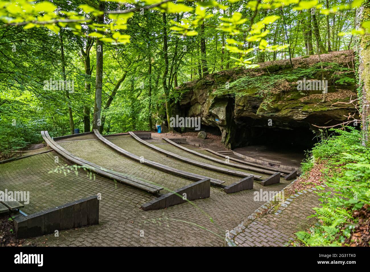 The amphitheater "Breechkaul" was established in 1979 in a rock hollowed out in the Middle Ages for the purpose of extracting millstones. There are held in the summer much attended concerts of all kinds. Berdorf, Luxembourg Stock Photo