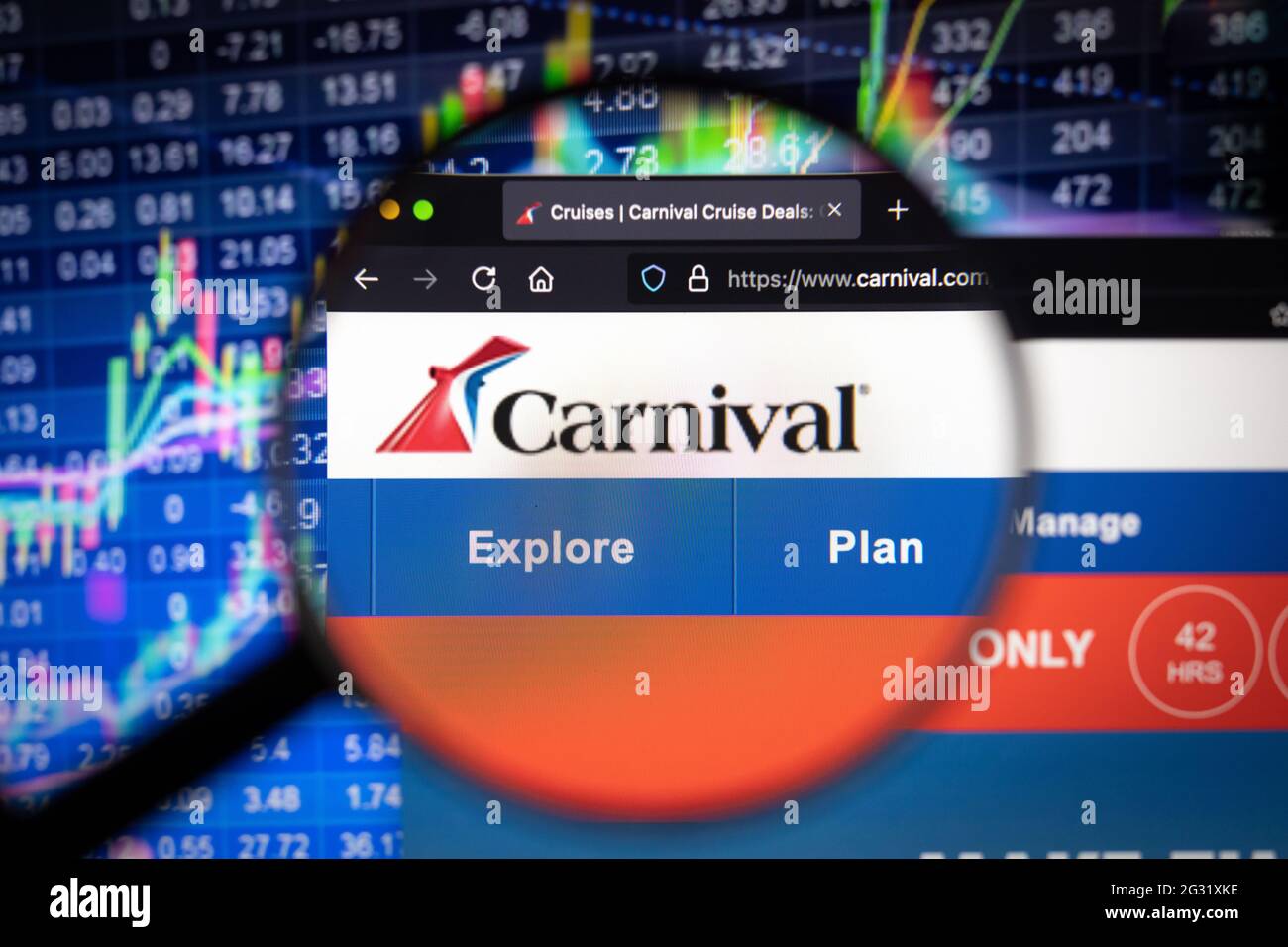 Carnival Cruise company logo on a website with blurry stock market developments in the background, seen on a computer screen Stock Photo