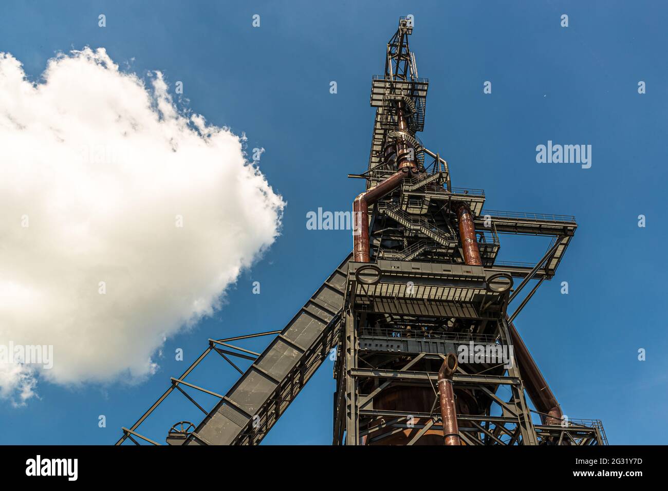 The decommissioned blast furnace stretches into the sky above the Belval university campus in Esch-sur-Alzette, Luxembourg Stock Photo