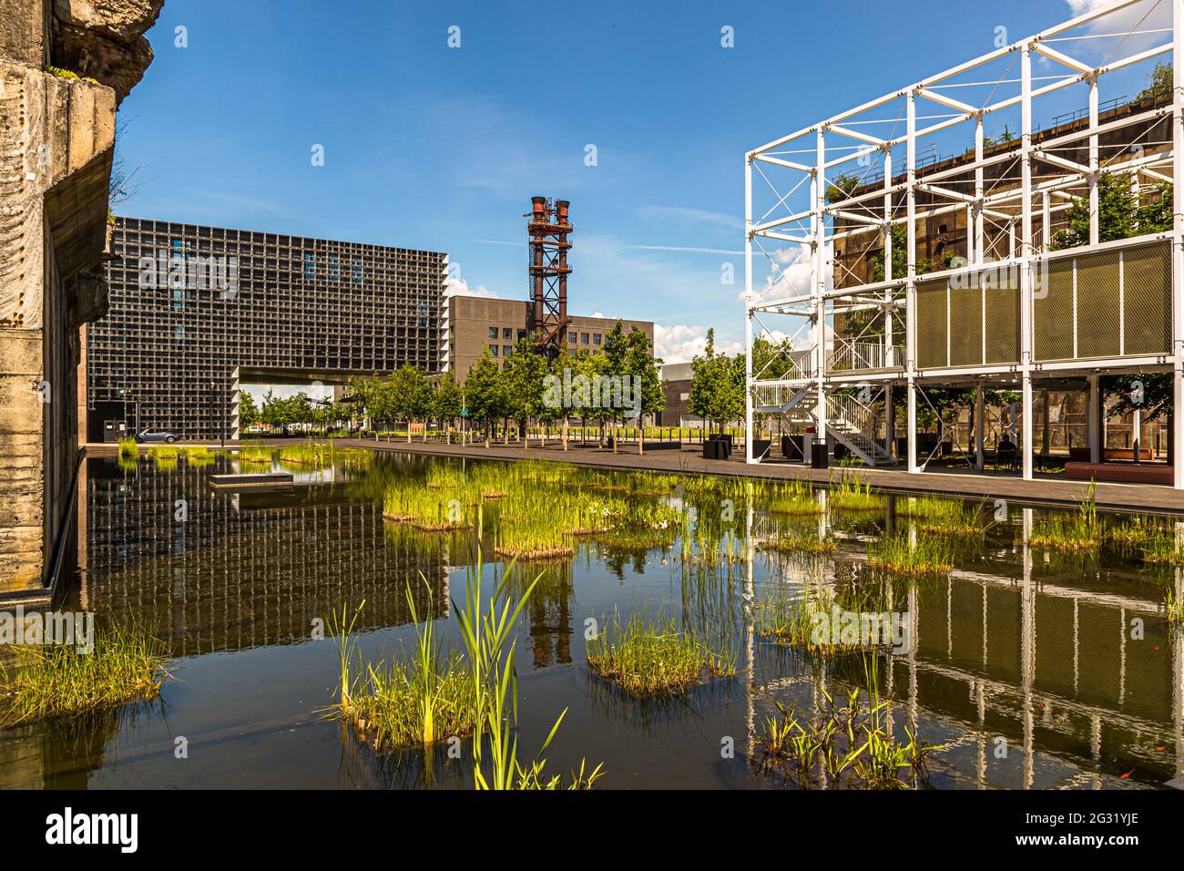 Belval Campus of the University of Luxembourg in Esch-sur-Alzette, Luxembourg. Belval University, with the House of Knowledge in the background. The white scaffolding offers students seating with a far-reaching view. But the old steel colossi always keep alive the memory of the region's historical heritage Stock Photo