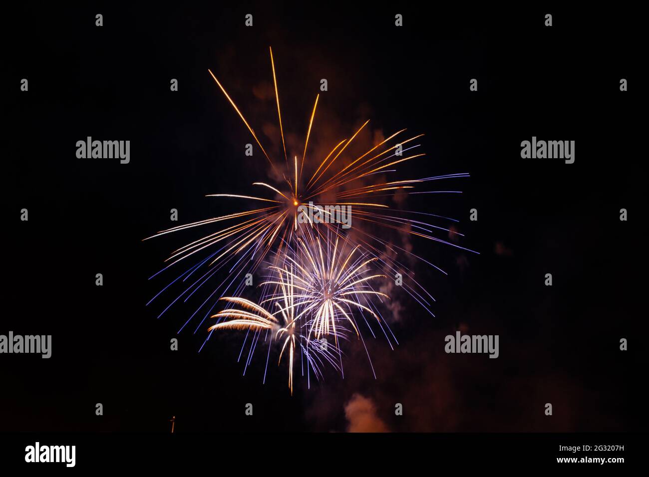 Dark sky with colorful firework blast Stock Photo - Alamy