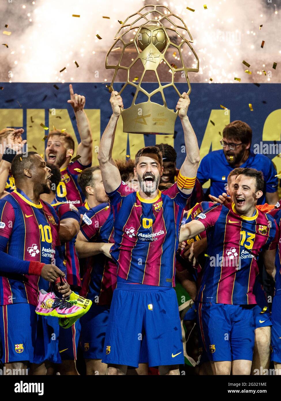 Cologne, Germany. 13th June, 2021. Handball: Champions League, FC Barcelona  - Aalborg HB, Final Round, Final Four, Final at the Lanxess Arena.  Barcelona's Raul Entrerrios raises the trophy as he celebrates with