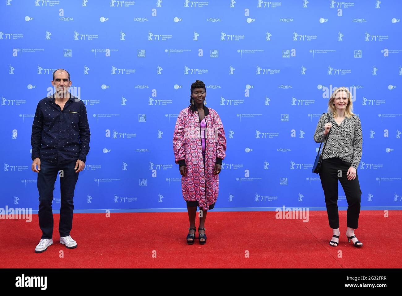 Berlin, Germany. 13th June, 2021. The winners in the documentary category 2021, Clement Alline (l-r), Alice Diop and Sarah Blum, pose during the 71st Berlin International Film Festival before the award ceremony during the film festival 'Berlinale Summer Special'. Credit: Tobias Schwarz/AFP-Pool/dpa/Alamy Live News Stock Photo
