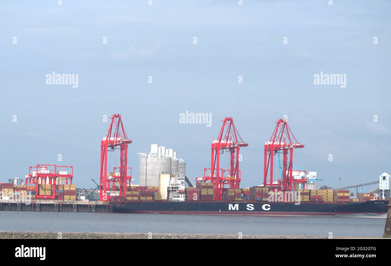 A cargo ship that carries all of its load in trucksize intermodal containers, in a technique