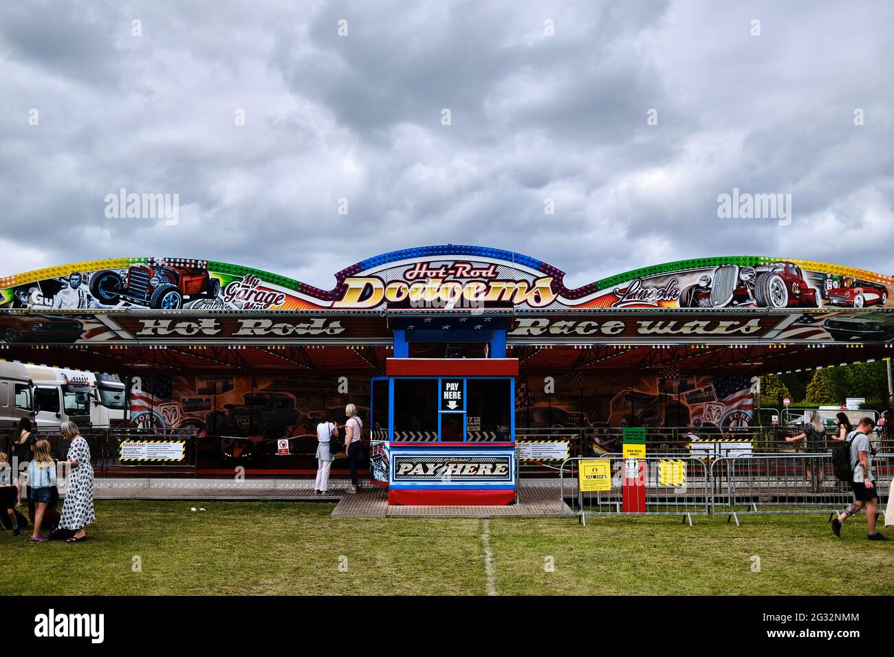 Dodgems bumper car fairground ride with a colourful facade under grey ...