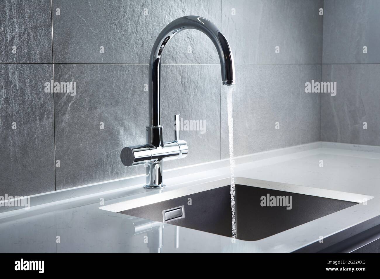 Kitchen water mixer. Water tap made of chrome material Stock Photo Alamy